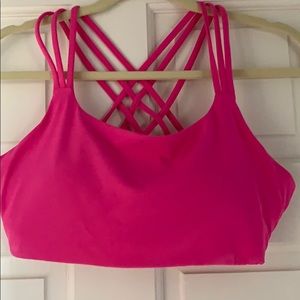 Large pink Athleta bra with removable pads.